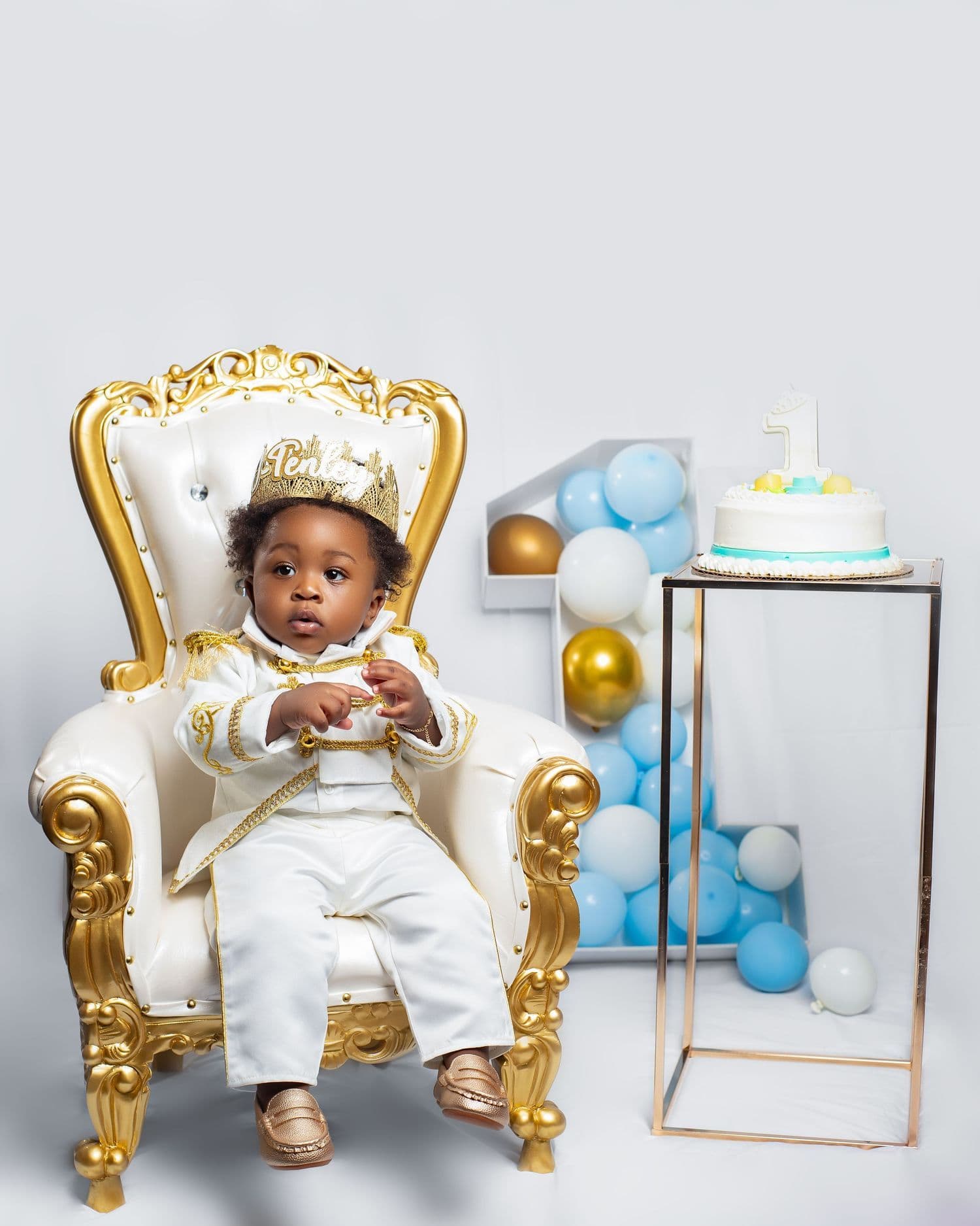 First birthday portrait on a gold throne